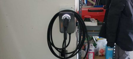 EV Charger installed indoors plugged in