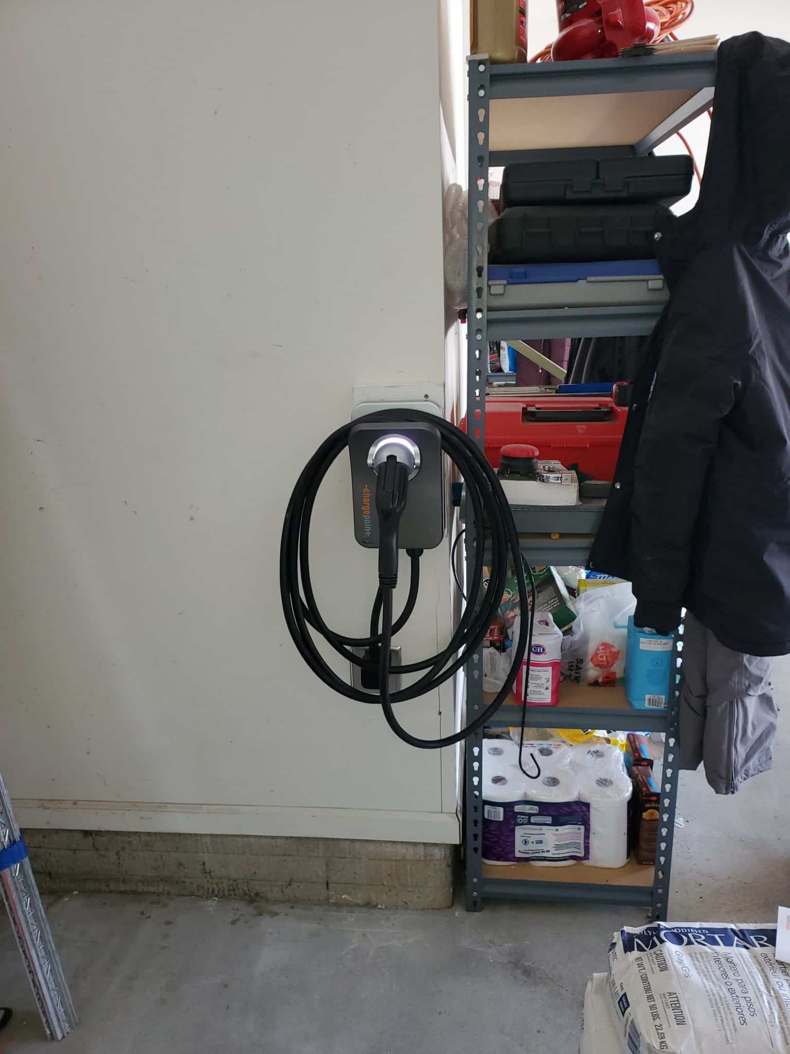 EV Charger installed indoors plugged in