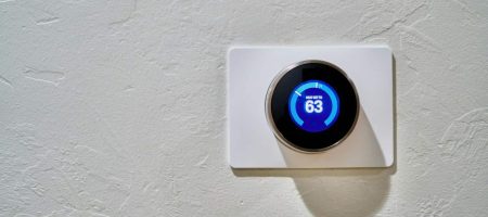 Smart Thermostat on blank wall