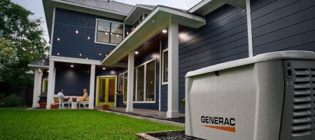 Home standby generator installed outside a modern house providing backup power during storm season