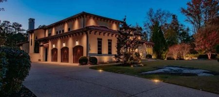Modern home exterior with pathway and entry lighting installed for safety security and curb appeal