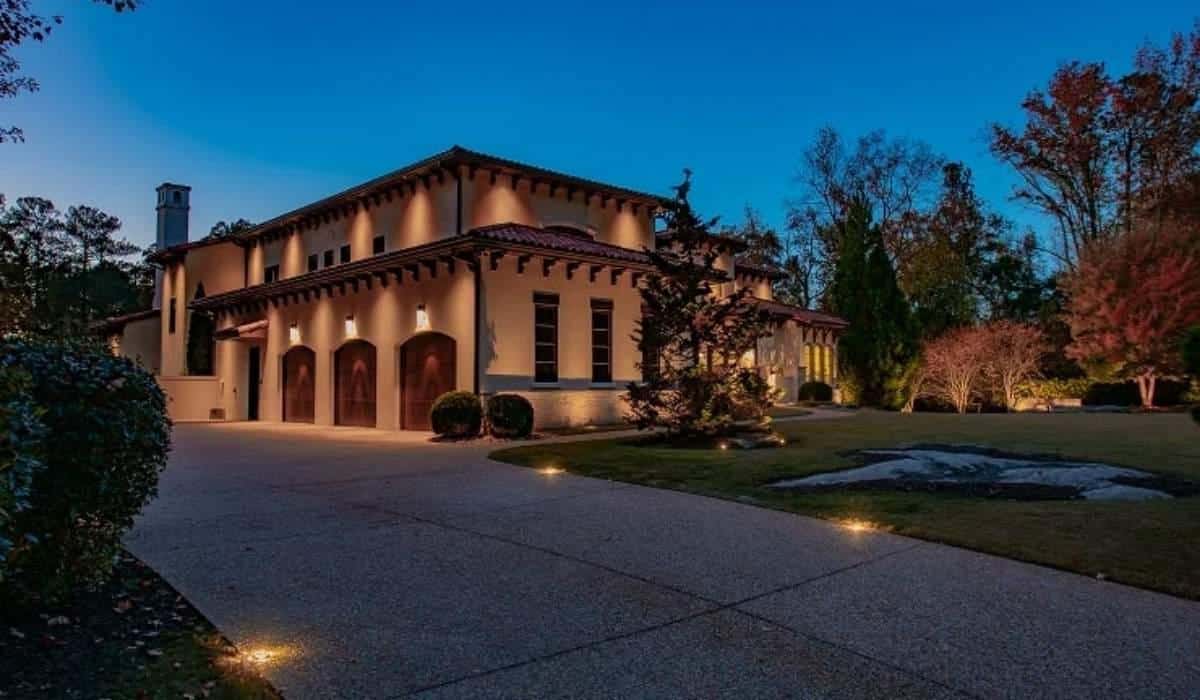 Modern home exterior with pathway and entry lighting installed for safety security and curb appeal