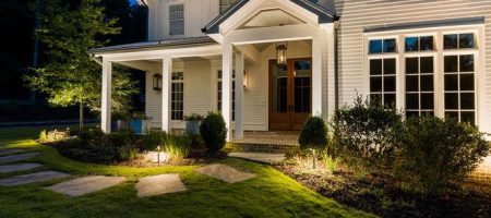 Modern home exterior in spring with outdoor lighting and electrical outlets inspected for safety by Sentry Electric in Lincoln NE